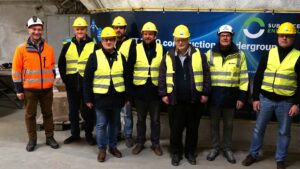 Group of people wearing helmets and safety vests